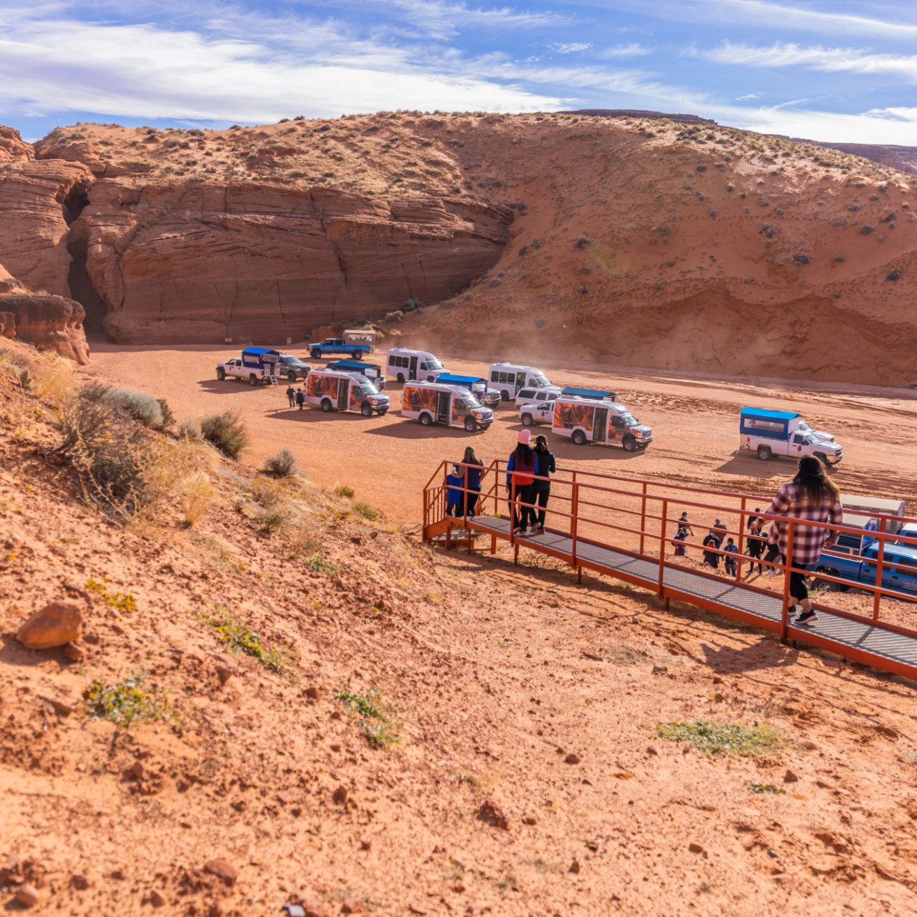 a group of people sitting at a canyon